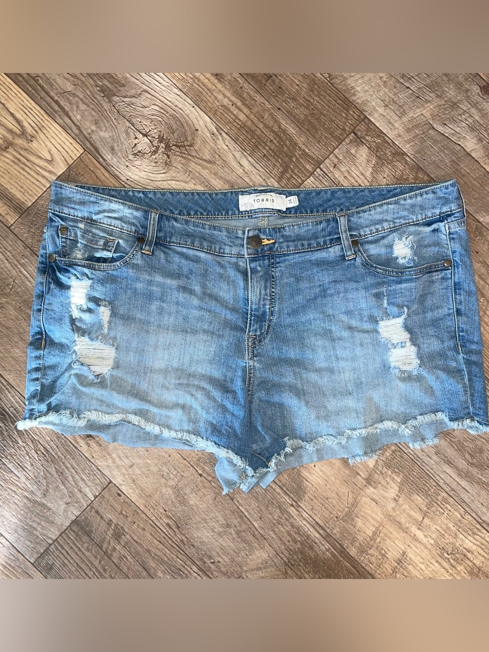 torrid distressed light blue denim cut-off shorts